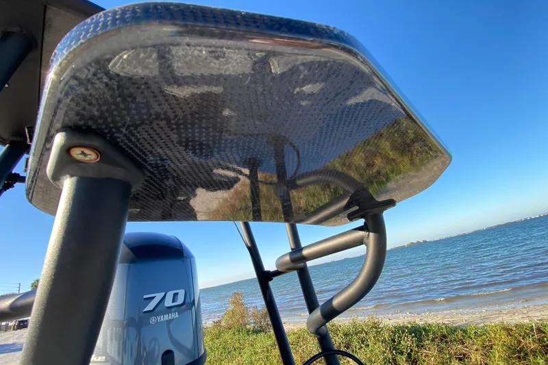 Slide: The Image of 2024 Drake Boatworks Nomad with Yamaha 70 engine by the shoreline. - 63