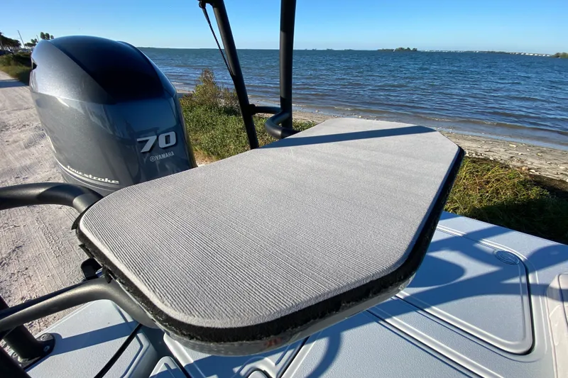 Slide: The Image of 2024 Drake Boatworks Nomad with Yamaha 70 engine by the shoreline. - 64