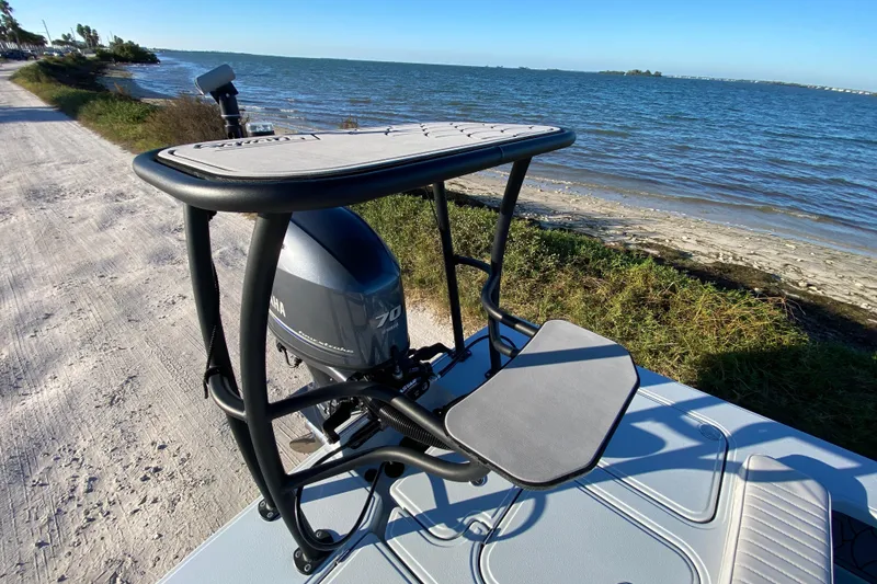 Slide: The Image of 2024 Drake Boatworks Nomad with Yamaha engine by the shoreline. - 65