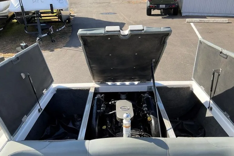 Slide: The Image of Open engine compartment of 2015 Moomba Outback V boat, showcasing engine details. - 15