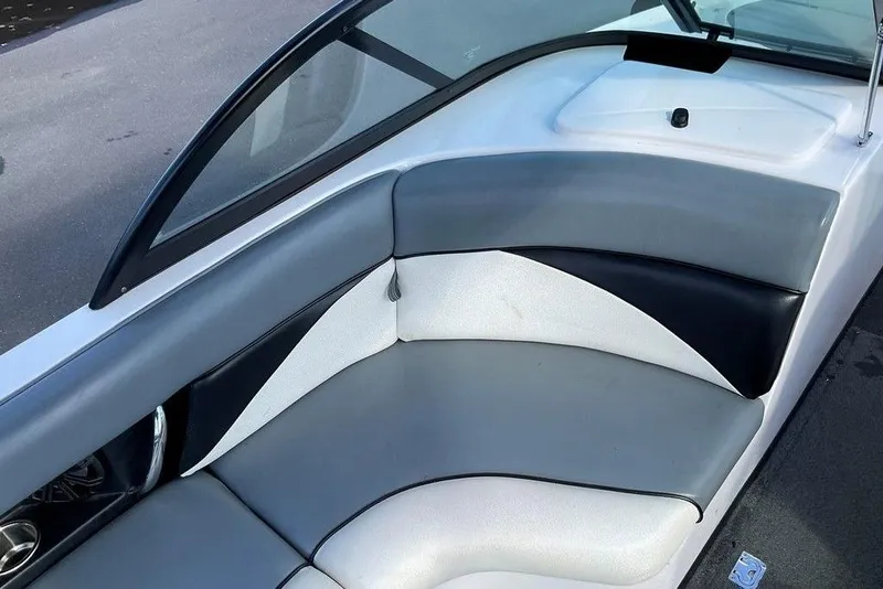 Slide: The Image of 2015 Moomba Outback V boat interior with gray and white seating. - 2