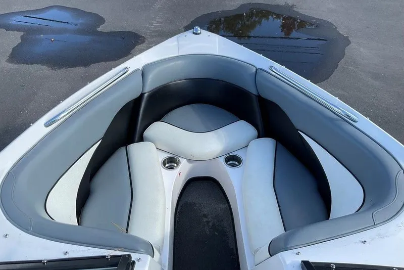 Slide: The Image of 2015 Moomba Outback V boat interior with gray seating and cup holders. - 5