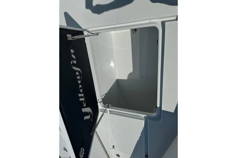 Slide: The Image of Open storage compartment on 2024 Yellowfin 39 Offshore boat, showcasing interior space. - 22