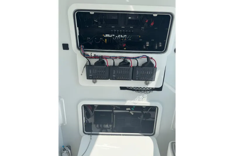 Slide: The Image of 2024 Yellowfin 39 Offshore boat electrical panel with wiring and components. - 24