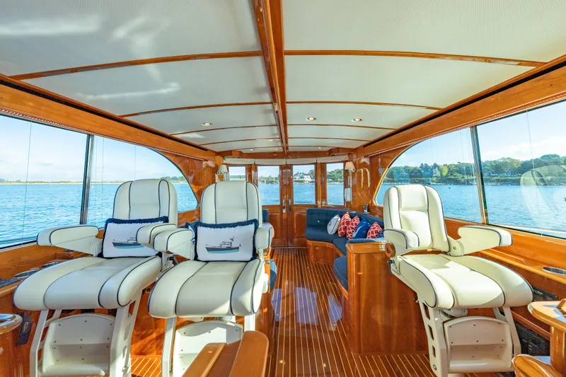 Slide: The Image of Luxurious interior of 2013 Hinckley Talaria 48 Flybridge yacht with plush seating and scenic views. - 18