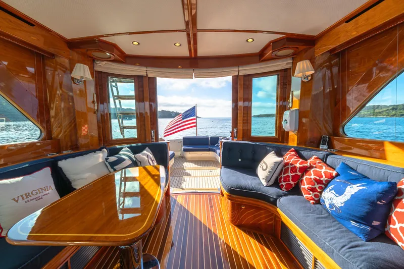 Slide: The Image of Luxurious interior of 2013 Hinckley Talaria 48 Flybridge yacht with elegant wood finish and plush seating. - 19