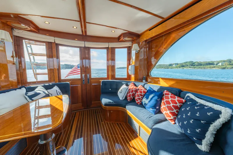 Slide: The Image of Luxurious interior of 2013 Hinckley Talaria 48 Flybridge yacht with elegant wood finish and ocean view. - 22