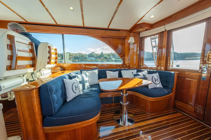 Slide: The Image of Luxurious interior of 2013 Hinckley Talaria 48 Flybridge yacht with elegant seating and wooden finishes. - 23