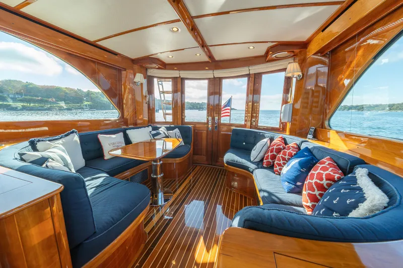 Slide: The Image of Luxurious 2013 Hinckley Talaria 48 Flybridge interior with elegant wood finish and plush seating. - 24