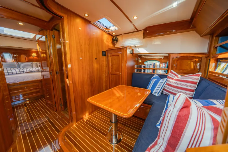 Slide: The Image of Luxurious 2013 Hinckley Talaria 48 Flybridge interior with wood finish and cozy seating area. - 27
