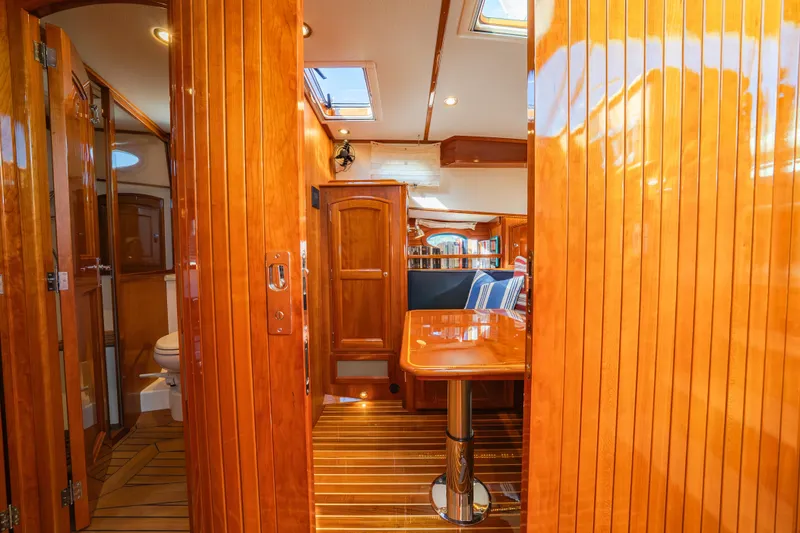 Slide: The Image of Luxurious 2013 Hinckley Talaria 48 Flybridge interior with polished wood and elegant furnishings. - 29