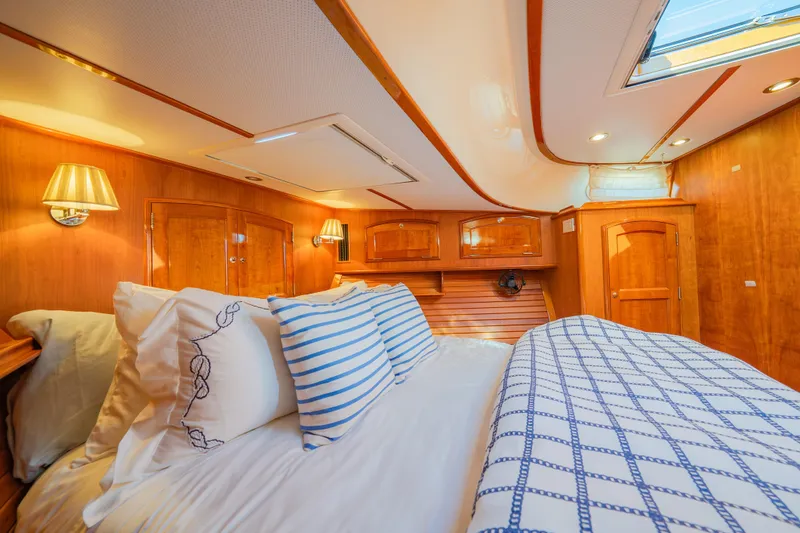 Slide: The Image of Luxurious cabin interior of 2013 Hinckley Talaria 48 Flybridge with elegant wood finish. - 31