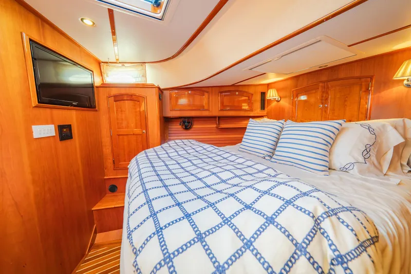 Slide: The Image of Luxurious cabin interior of 2013 Hinckley Talaria 48 Flybridge yacht with cozy bedding. - 32