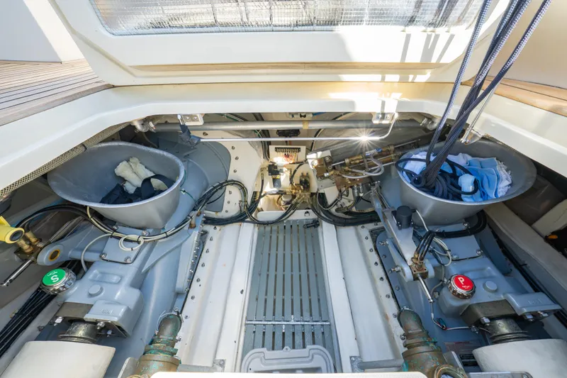 Slide: The Image of Engine room of 2013 Hinckley Talaria 48 Flybridge yacht, showcasing mechanical components. - 35