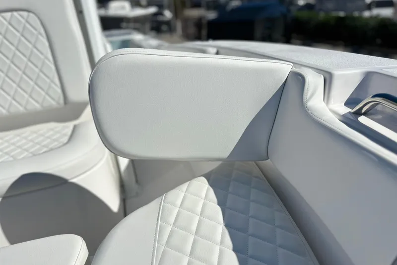 Slide: The Image of 2026 Sea Fox 228 Commander boat interior with white cushioned seating. - 10