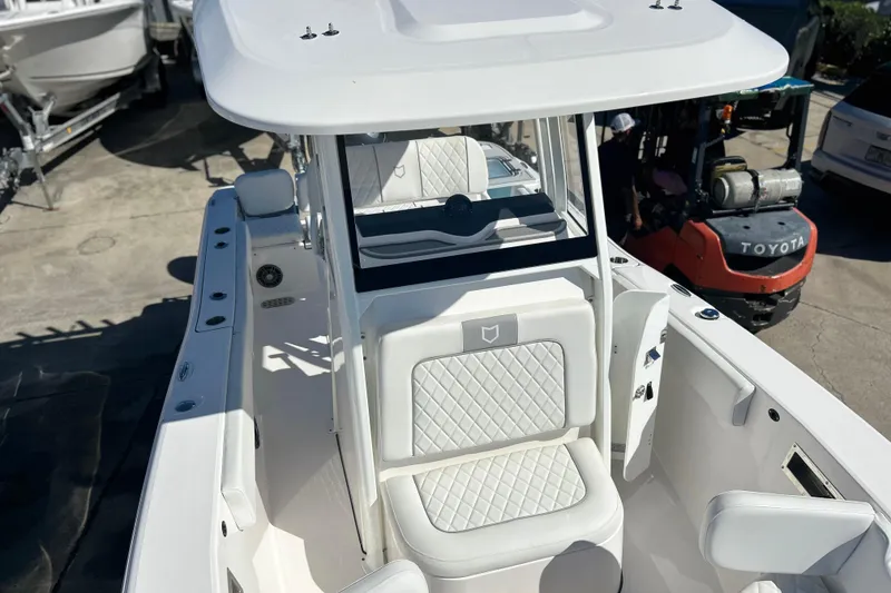 Slide: The Image of 2026 Sea Fox 228 Commander boat with white seating and sleek design. - 15