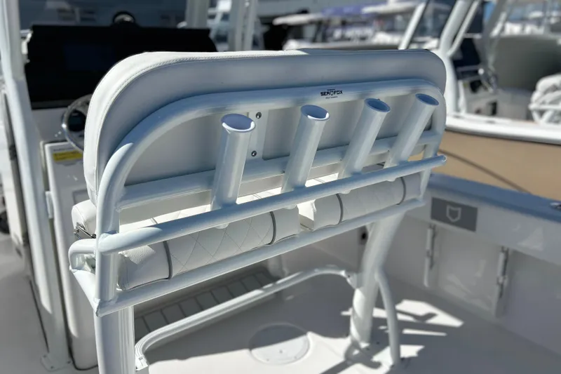 Slide: The Image of 2026 Sea Fox 228 Commander boat interior with rod holders and seating. - 21