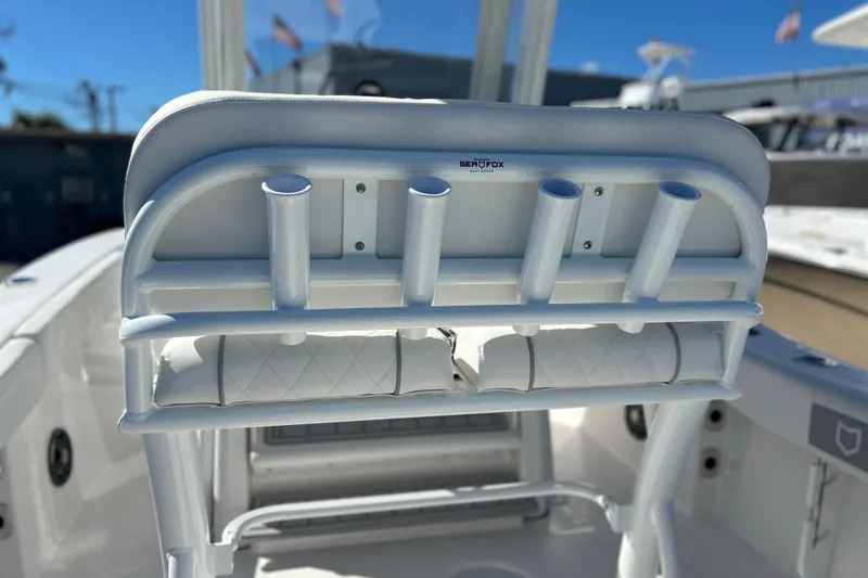 Slide: The Image of 2026 Sea Fox 228 Commander boat seat with rod holders, showcasing sleek design. - 22