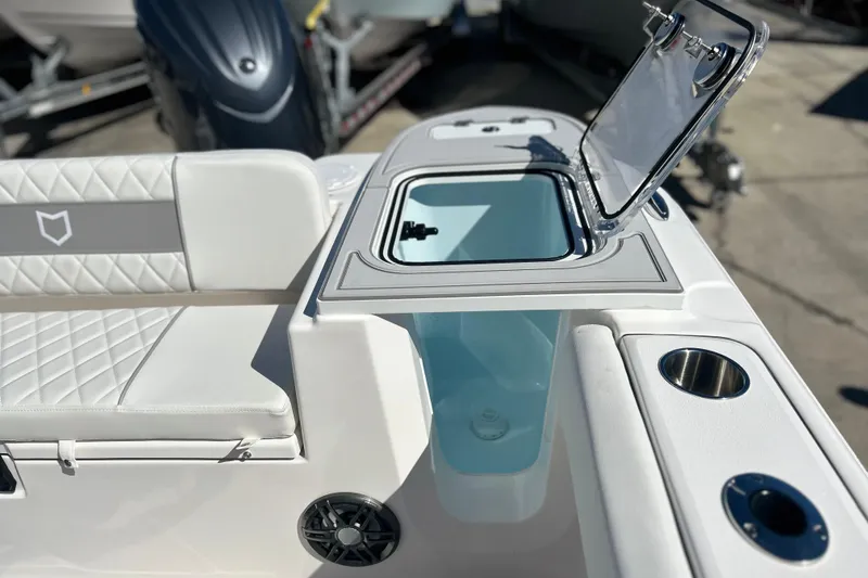 Slide: The Image of 2026 Sea Fox 228 Commander boat interior with open storage compartment and seating. - 24
