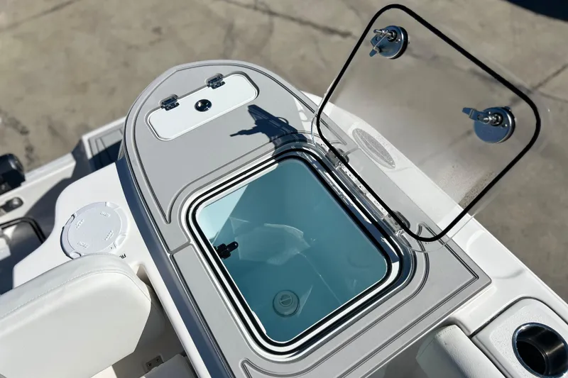Slide: The Image of 2026 Sea Fox 228 Commander boat with open storage compartment and clear lid. - 25
