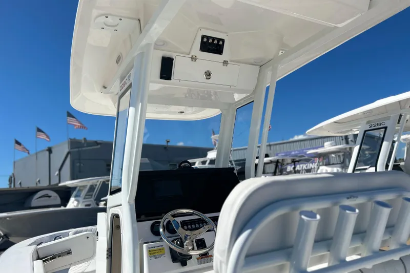 Slide: The Image of 2026 Sea Fox 228 Commander boat interior with steering wheel and control panel. - 27