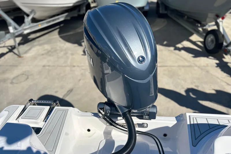 Slide: The Image of 2026 Sea Fox 228 Commander with Yamaha outboard motor, displayed on a trailer. - 33