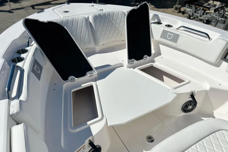 Slide: The Image of 2026 Sea Fox 228 Commander boat interior with open storage compartments and seating. - 4