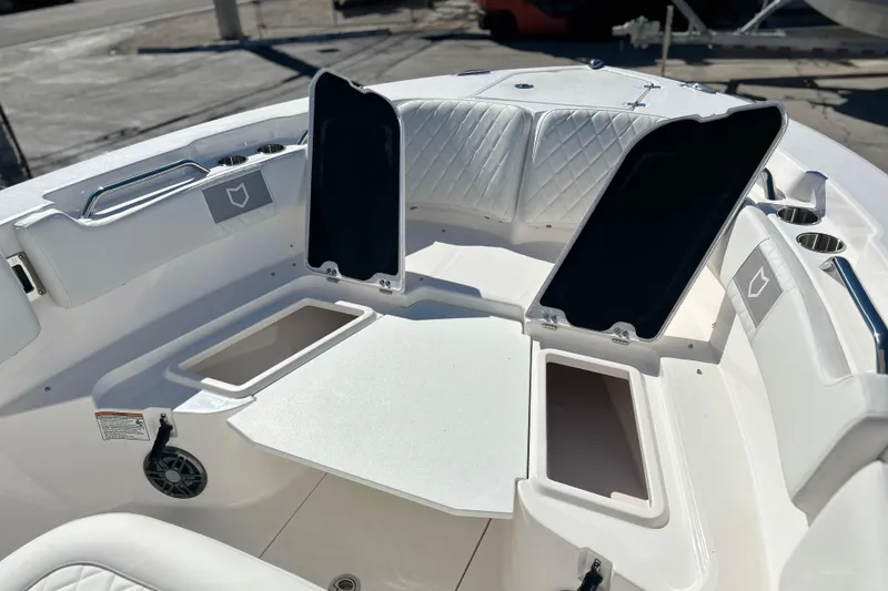 Slide: The Image of 2026 Sea Fox 228 Commander boat interior with open storage compartments. - 5