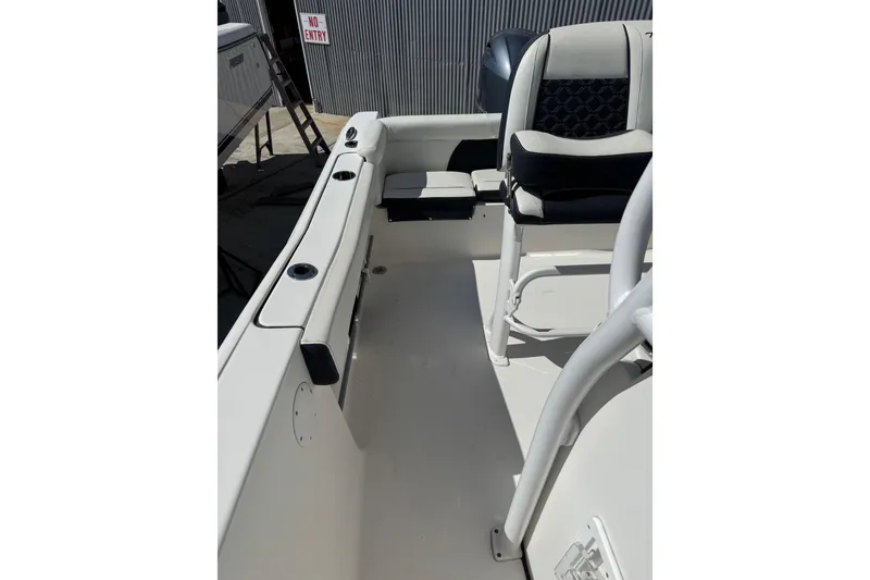 Slide: The Image of 2021 Tidewater 220 LXF boat interior with seating and rod holders. - 12