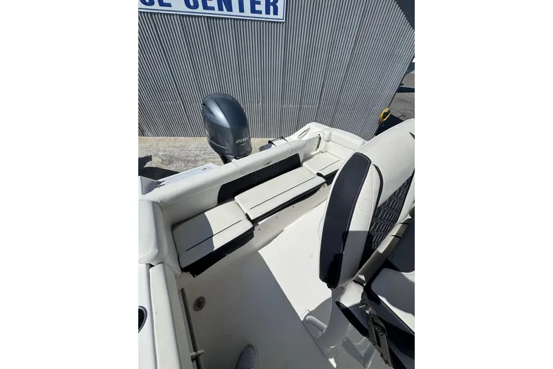 Slide: The Image of 2021 Tidewater 220 LXF boat interior with seating and outboard motor. - 18