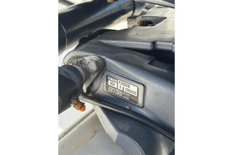 Slide: The Image of Close-up of a Yamaha F200XB engine part on a 2021 Tidewater 220 LXF boat. - 2