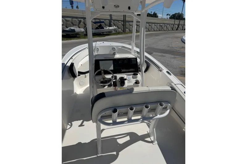 Slide: The Image of 2021 Tidewater 220 LXF boat console with steering wheel and controls. - 4