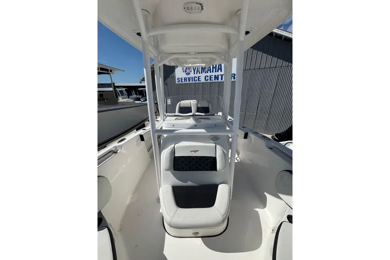 Slide: The Image of 2021 Tidewater 220 LXF boat interior with seating, located at Yamaha service center. - 9