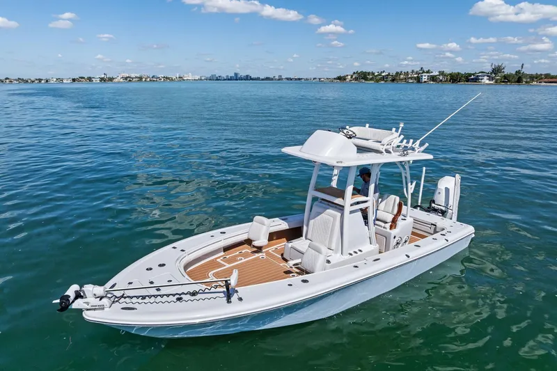 Slide: The Image of 2021 Barker Boatworks 26 Open on calm blue water under a clear sky. - 11
