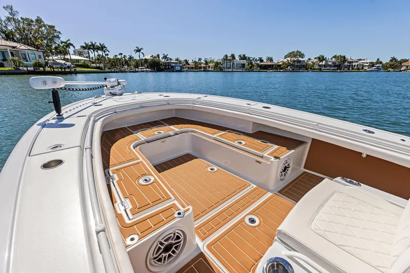 Slide: The Image of 2021 Barker Boatworks 26 Open on calm water, featuring spacious deck and seating. - 18