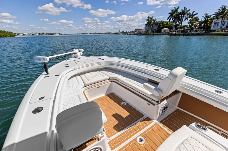 Slide: The Image of 2021 Barker Boatworks 26 Open on serene water with luxurious seating and clear skies. - 19