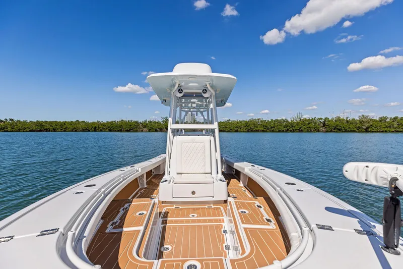 Slide: The Image of 2021 Barker Boatworks 26 Open on calm water under clear blue sky. - 20