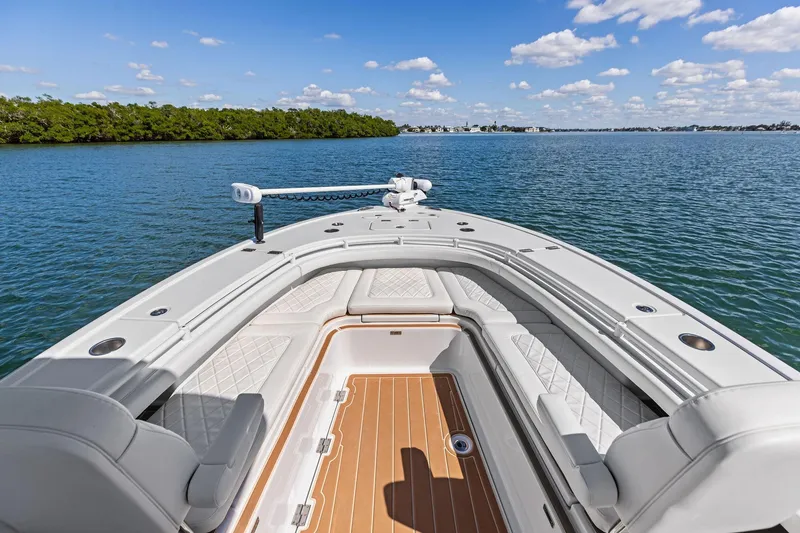 Slide: The Image of 2021 Barker Boatworks 26 Open on calm water, featuring spacious seating and clear skies. - 22