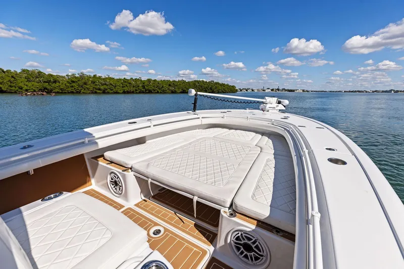 Slide: The Image of 2021 Barker Boatworks 26 Open on calm water, featuring luxurious seating and clear skies. - 25