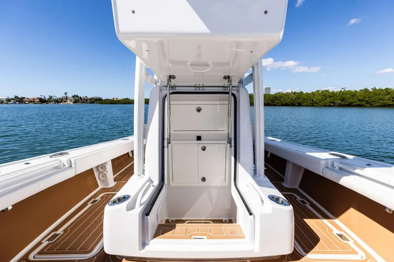 Slide: The Image of 2021 Barker Boatworks 26 Open, spacious deck with storage, on calm water. - 26