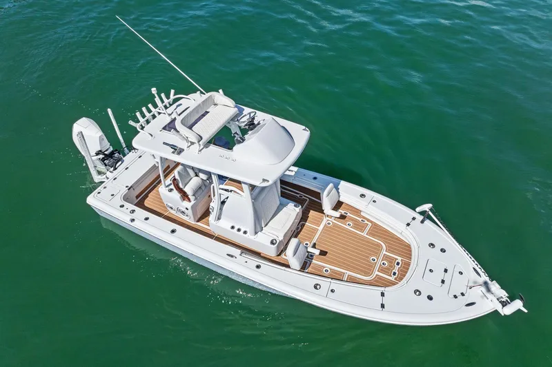 Slide: The Image of 2021 Barker Boatworks 26 Open on water, showcasing sleek design and spacious deck. - 3