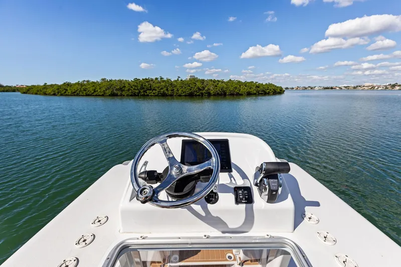 Slide: The Image of 2021 Barker Boatworks 26 Open helm with scenic water view. - 32