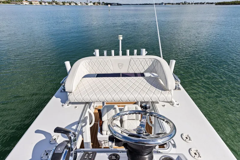 Slide: The Image of 2021 Barker Boatworks 26 Open helm with luxurious seating on calm water. - 34