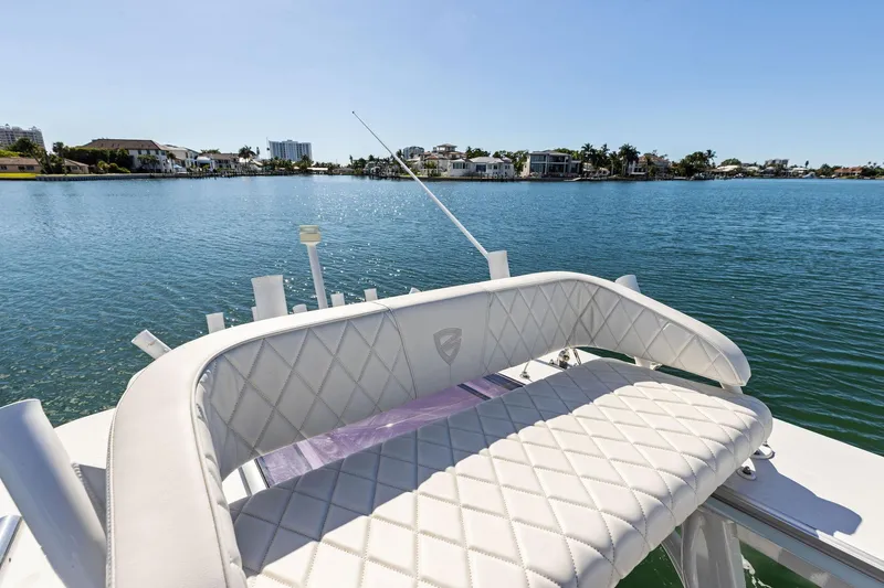 Slide: The Image of 2021 Barker Boatworks 26 Open on serene water with luxurious seating. - 35