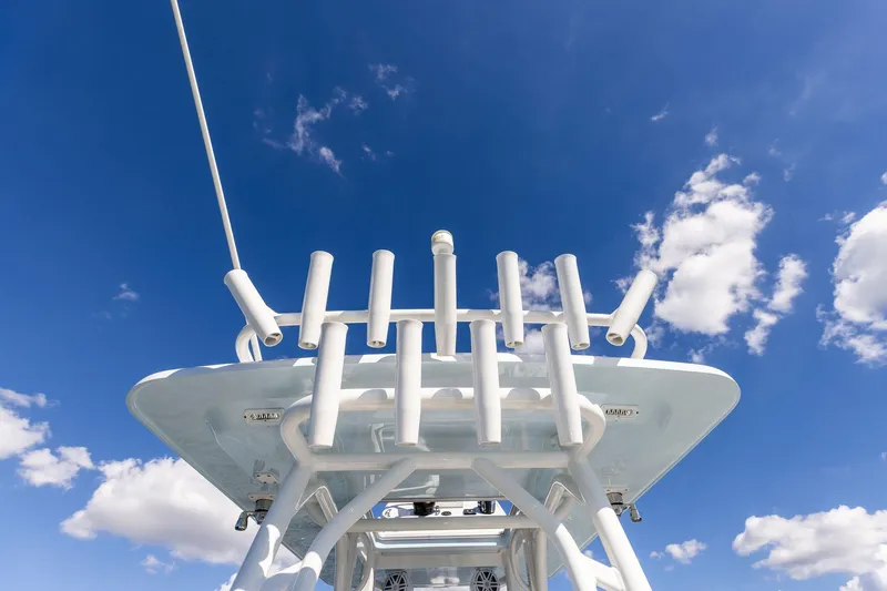 Slide: The Image of 2021 Barker Boatworks 26 Open against a bright blue sky with clouds. - 37