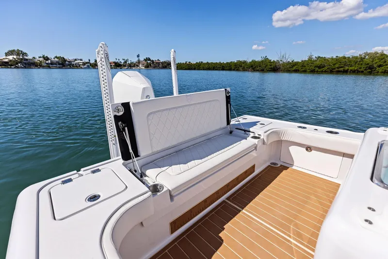 Slide: The Image of 2021 Barker Boatworks 26 Open, featuring a spacious deck and comfortable seating on calm waters. - 39