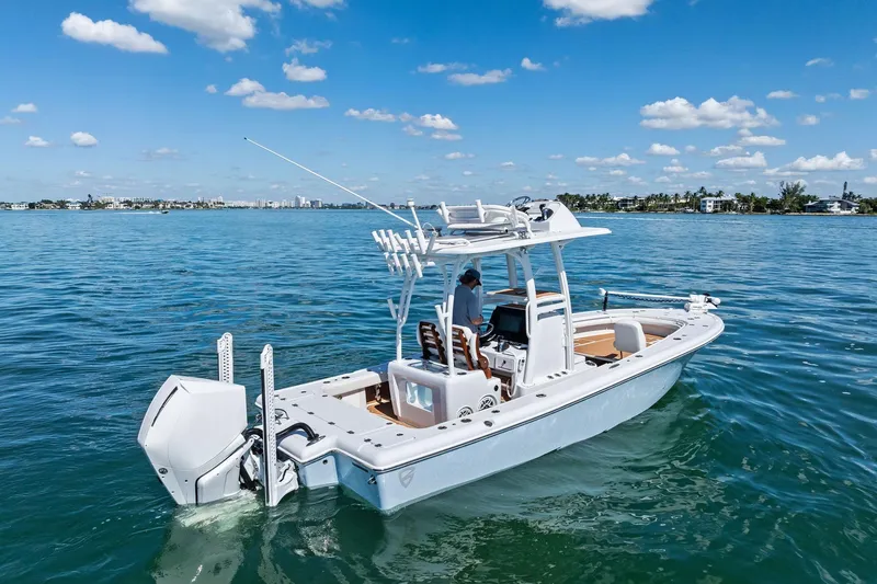 Slide: The Image of 2021 Barker Boatworks 26 Open cruising on a sunny day, clear blue water. - 4