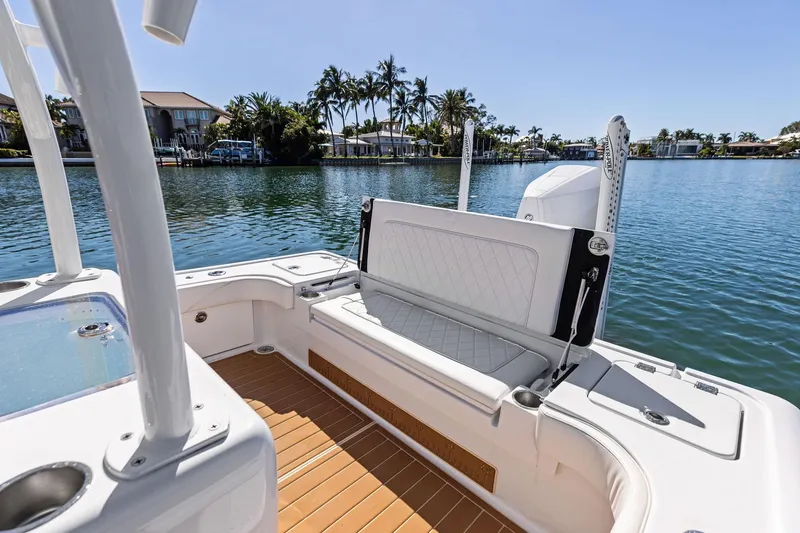 Slide: The Image of 2021 Barker Boatworks 26 Open on serene water, featuring elegant seating and modern design. - 41