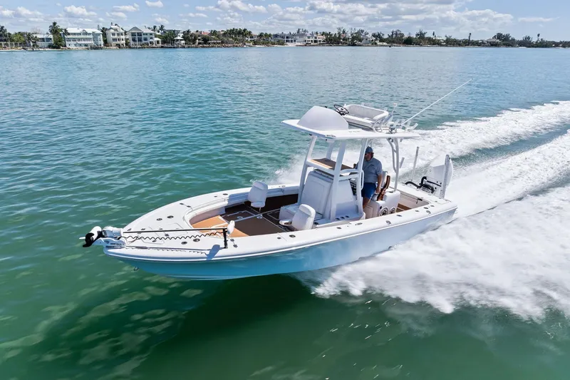 Slide: The Image of 2021 Barker Boatworks 26 Open cruising on clear blue water. - 46