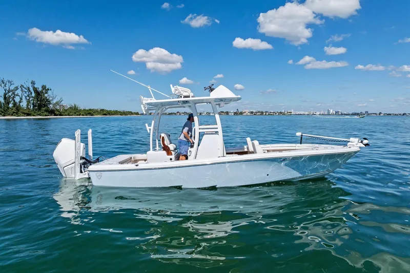 Slide: The Image of 2021 Barker Boatworks 26 Open on calm water under blue sky. - 5
